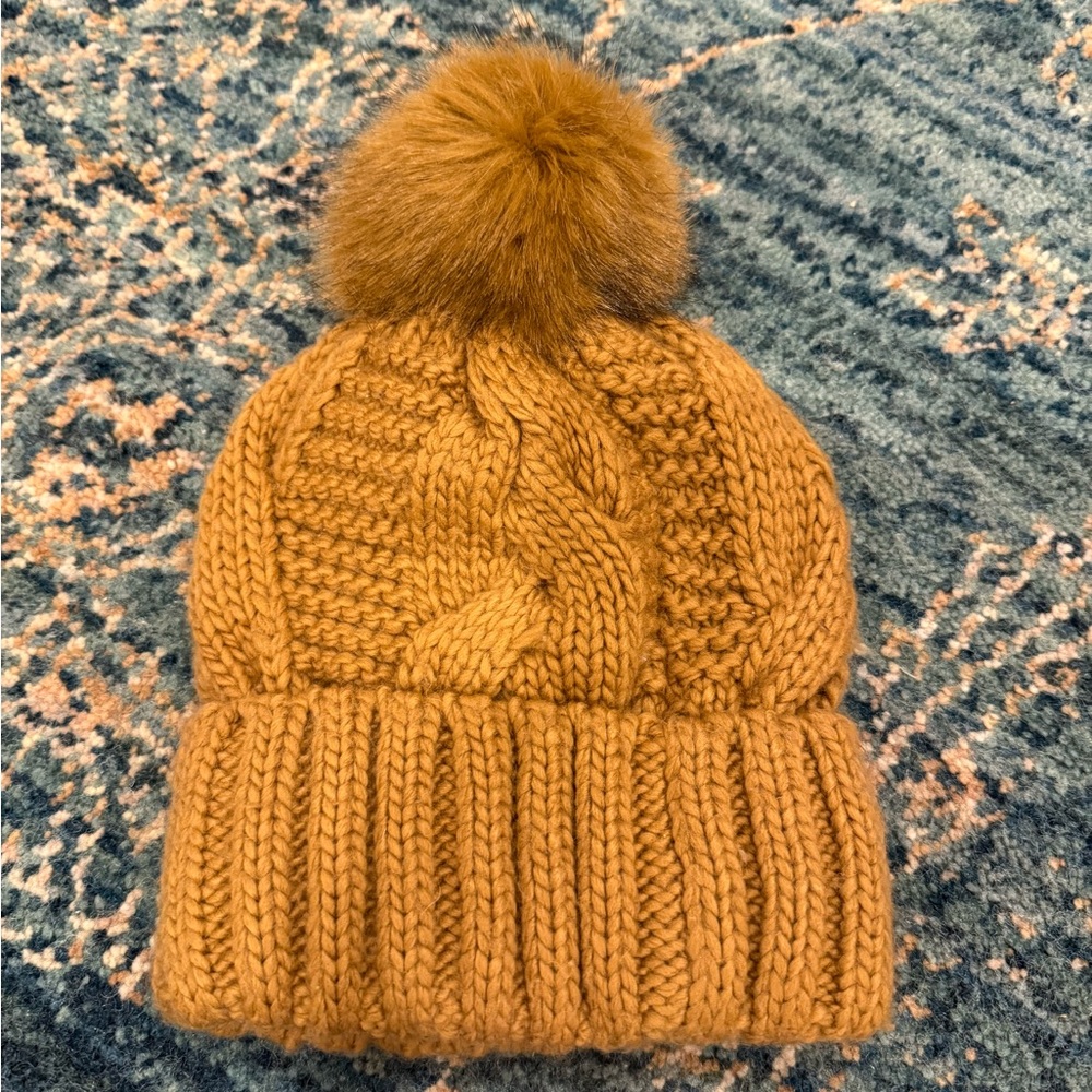 Beanie with faux fur pom